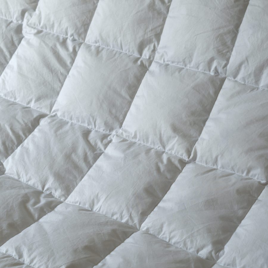 Detail of down comforter with white squares