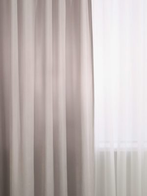 Light grey window curtains and white tulle indoors, closeup