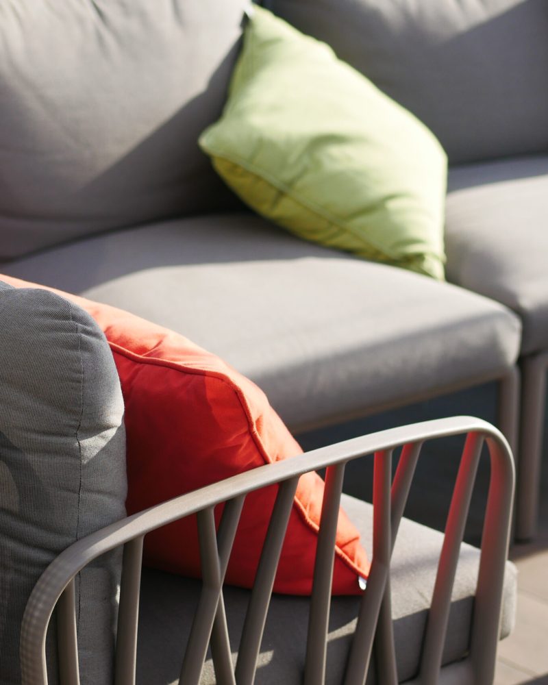 modern grey sofa with pillows in living room at home. High quality photo