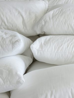 Close up of many white pillows